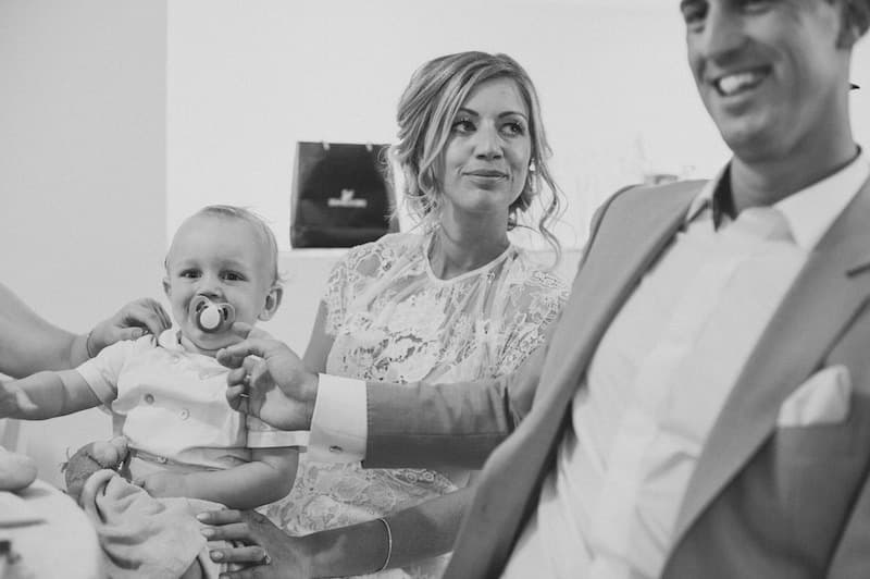 bride holding baby during speech