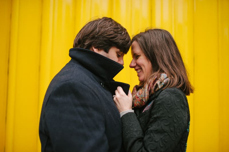 Creative portrait of couple yellow background