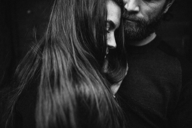 black and white image of couple during tender moment