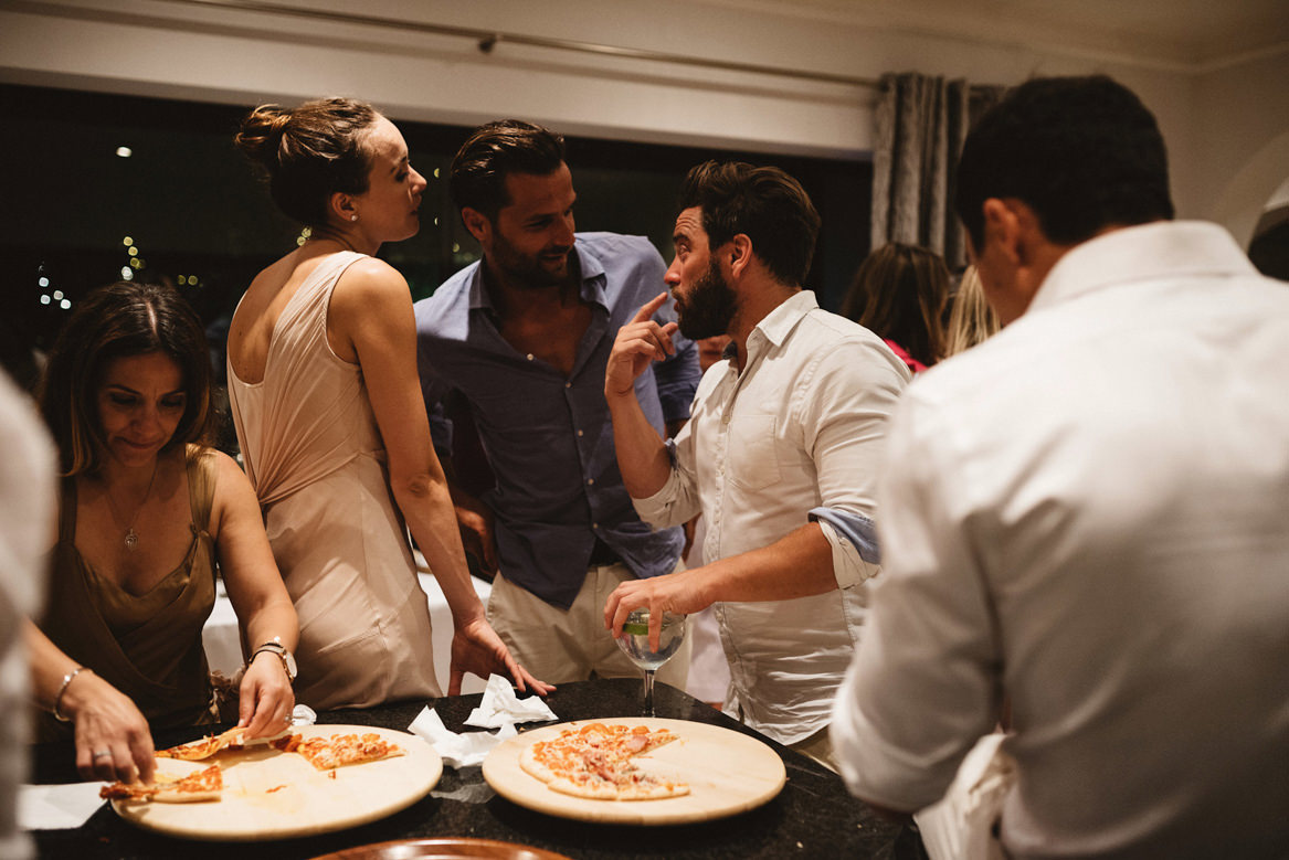 guests having late night pizza during wedding at casa rupi